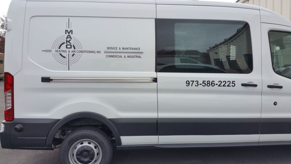 MAKO Heating & Air Conditioning logo and phone number lettering on a white Ford Transit van, Denville NJ