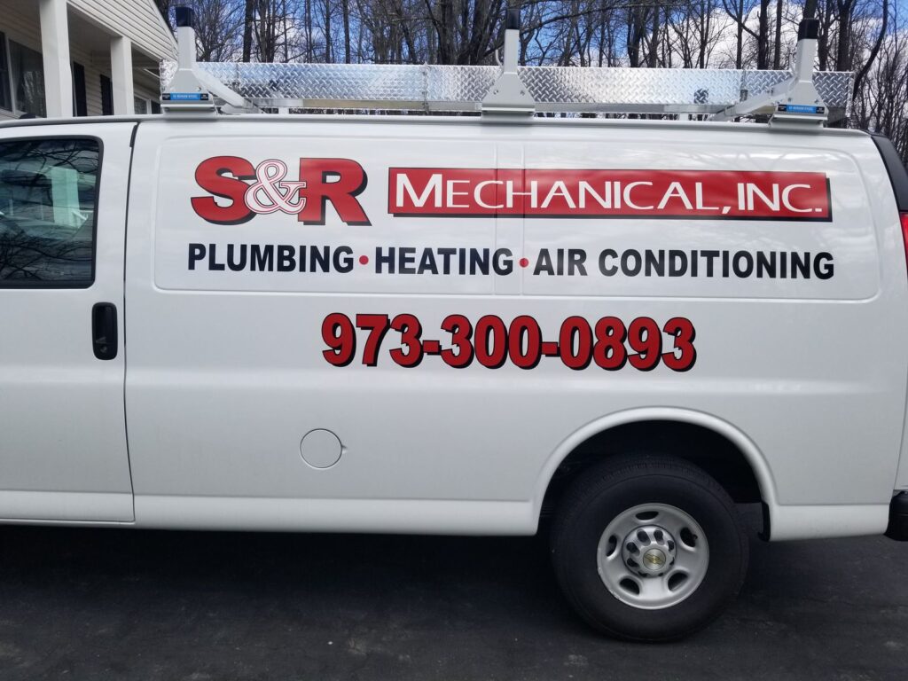 S&R Mechanical matching fleet lettering on a white Chevy Express van with ladder rack, Hackettstown NJ