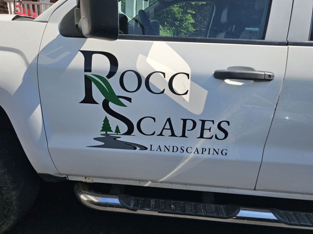 Rocc Scapes Landscaping logo lettering on a white Ford Super Duty pickup door, Mt Olive NJ
