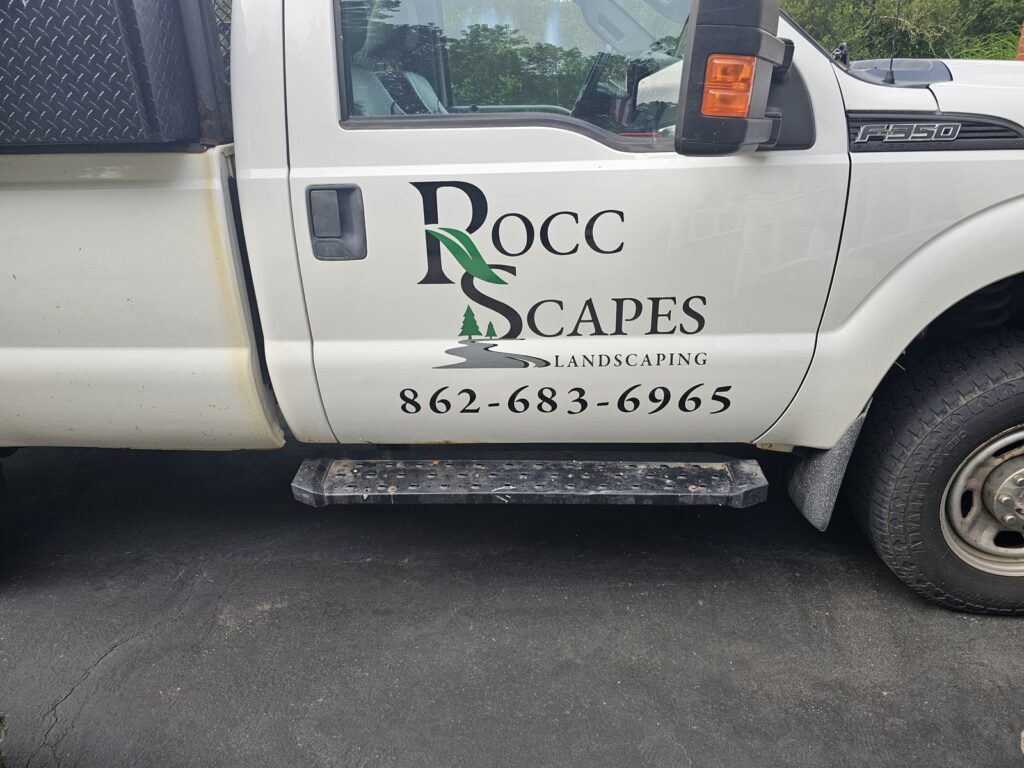 Rocc Scapes Landscaping door lettering with phone number on a white Ford pickup truck, Mt Olive NJ