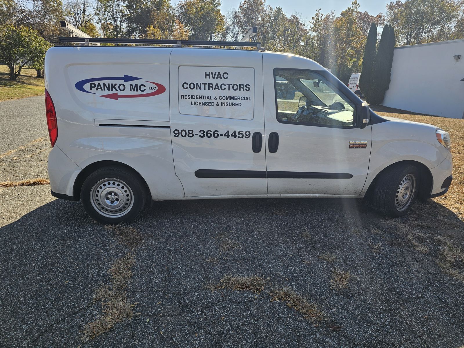 Panko MC LLC Ram ProMaster City van after, side view, with blue and red logo, HVAC contractors block and phone number in cut vinyl, HVAC van lettering Hackettstown NJ