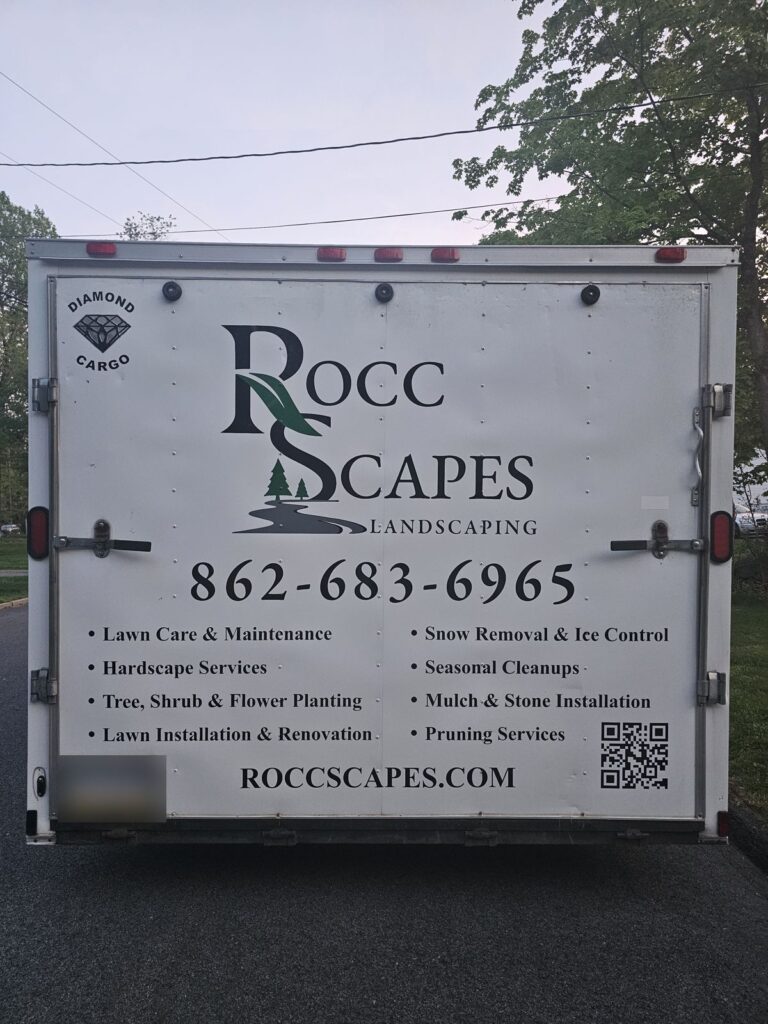 Rocc Scapes Landscaping logo, services list and website lettering on cargo trailer rear doors, Mt Olive NJ
